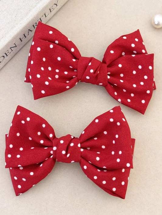 Product image of 2-Piece Polka Dot Bow Hair Clip from H&N Hearts online boutique