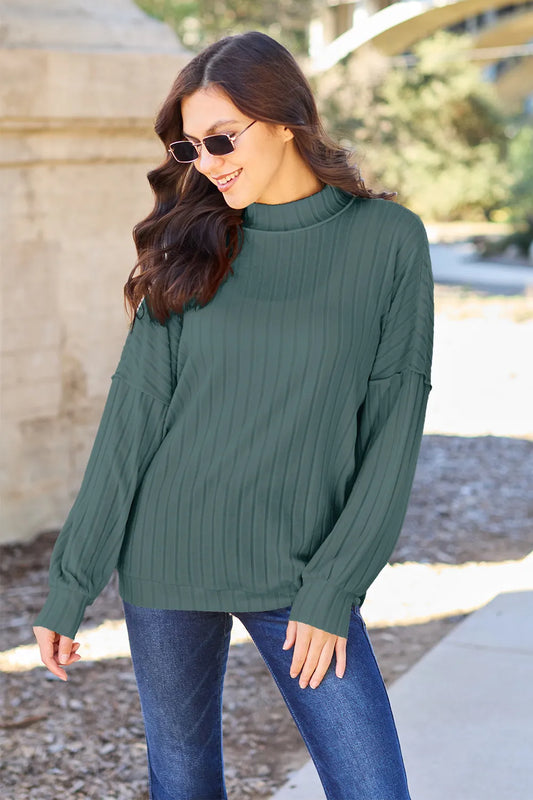 Product image of Basic Bae Full Size Ribbed Exposed Seam Mock Neck Knit Top from H&N Hearts online boutique
