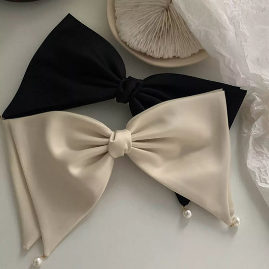 Product image of Satin Pearl Bow Hair Clip from H&N Hearts online boutique